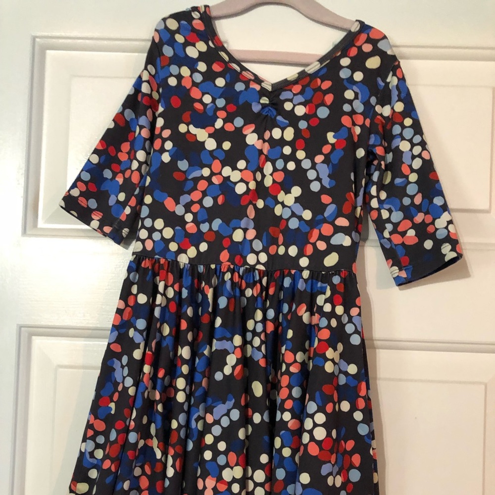 Navy dress with multiple color dots.